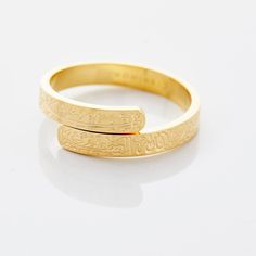 Thikr, or the 'remembrance of Allah', is a core part of our daily habits as Muslims. This gorgeous ring features a wrapped style that circles around your finger that contains the thikr of "SubhanAllah wa bihamdihi" which translates to "Glory be to Allah and Praise Him". This piece is meant to serve as a reminder to kee Adjustable Gold Engraved Spiritual Ring, Gold Adjustable Engraved Spiritual Ring, Adjustable Engraved Spiritual Ring, Traditional Adjustable Engraved Ring For Anniversary, Adjustable Spiritual Engraved Wedding Ring, Adjustable Engraved Spiritual Ring For Wedding, Adjustable Spiritual Engraved Ring For Wedding, Spiritual Adjustable Engraved Wedding Ring, Traditional Adjustable Rings As Gift