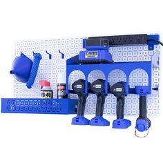 a blue tool rack with tools hanging from it's sides and on the wall