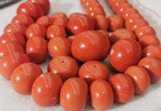 some orange beads are laying on the table