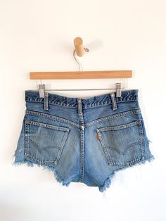 Perfectly shredded Levi’s orange tab cutoff denim shorts. Rugged in all the best ways. Fabric: DenimLabel: Levi'sEra: 1970's Measurements:Waist 31"Hips 42"Rise 11"Length 10.5" Condition: Very good Cutoff Jean Shorts With Pockets, Vintage Jean Shorts With Belt Loops For Summer, Levi's Relaxed Fit Jean Shorts With Frayed Hem, Retro Cotton Jean Shorts With Frayed Hem, Retro Short Bottoms With Frayed Hem, Retro Ripped Medium Wash Bottoms, Levi's High-waist Shorts With Frayed Hem, Levi's Cotton Cutoff Shorts, Levi's Jean Shorts With Frayed Hem