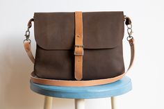 Hip, handmade shoulder bag brown smooth leather metal buckle dimensions: 27 - 20 - 4 cm inside compartment 17 - 10 cm back pocket 22 - 13 cm shoulder strap 110 cm Leather Shoulder Bag With Buckle For Daily Use, Leather Shoulder Bag With Buckle Closure For Daily Use, Rectangular Leather Shoulder Bag With Buckle Closure, Classic Brown Satchel With Buckle Closure, Leather Satchel Shoulder Bag With Buckle Closure, Vintage Brown Satchel With Adjustable Strap For Everyday, Everyday Vintage Brown Satchel With Adjustable Strap, Leather Shoulder Bag With Buckle Closure, Leather Saddle Shoulder Bag With Buckle