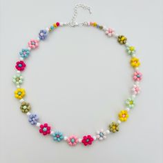 Style code: BA002 Material: Beads,Glass Bead Color: Multi colour, Colorful Weight: 16.8g/0.6oz Dimensions (Overall):  43cm/16.9inch Closure: Lobster claw Chain style: Bead Notice: Since this beaded daisy necklace  is handmade, there might be a little differences in each one, please kindly noticed Widely Application: Colorful Flower necklace handmade glass beads daisy choker kinda cute to wear on vacation to match your bathing suits or any outfit to add some summer vibe Feature: Colorful Flower n Colorful Beaded Flower Necklace For The Beach, Colorful Beaded Flower Necklace For Beach, Colorful Flower Necklace For Beach, Colorful Bead Flower Necklace For Beach, Colorful Beads Flower Necklace For Beach, Multicolor Beaded Chain Flower Necklace, Multicolor Flower Necklace With Beaded Chain, Multicolor Round Beads Flower Necklace For Summer, Handmade Flower Necklace With Round Beads For Beach