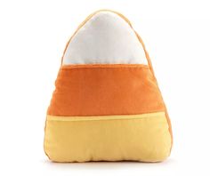 an orange, white and yellow pillow on a white background with the bottom half turned down