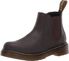 PRICES MAY VARY. The Dr. Martens Kid's Collection 2976 Chelsea boots will keep your cool kid cruising along in effortless style. Air-cushioned rubber sole. Cushioned insole. Elastic gussets. Full grain leather upper. The Dr. Martens Kid's Collection 2976 Chelsea boots will keep your cool kid cruising along in effortless style. Air-cushioned rubber sole. Cushioned insole. Elastic gussets. Full grain leather upper. Inner ankle zipper for easy on and off. Round toe silhouette. 2976 Chelsea Boots, Rubber Sole Boots, Cruise Kids, Boys Cowboy Boots, Cool Kid, Black Combat Boots, Soft Shoes, Cheap Shoes, Chelsea Boot