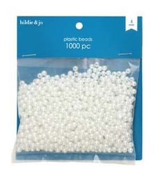 white beads in plastic packaging on a white background