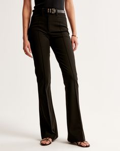 Elevate your wardrobe with the Abercrombie & Fitch Women's High Rise Flare Pants, a perfect blend of classic style and modern flair. These pants are designed to flatter your figure, with a high rise that fits snugly at the waist and hips, then relaxes slightly at the thigh before flaring elegantly at the knee into a full-length leg. 

- Size: 28
- Color: Black
- Material: Body - Polyester, Pocket Bag - Polyester
- Gender: Female
- Features: Stretch menswear fabric, sleek pintuck detail, function Modern Full-length Business Casual Bottoms, Full-length Elastane Bottoms For Business Casual, Business Casual Full-length Elastane Bottoms, Chic Straight Leg Pants With Seam Detailing, Classic Mid-rise Bottoms With Seam Detailing, Mid-rise Flares For Workwear In Fall, Classic Fitted Straight Leg Bottoms, Fitted Elastane Flare Trousers, Fitted High Waist Wide Leg Pants In Modern Style