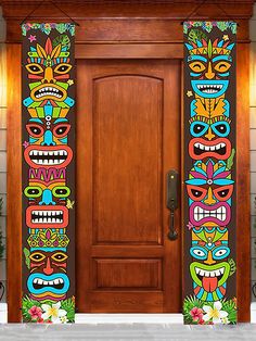 the front door is decorated with an image of tiki masks on it's side