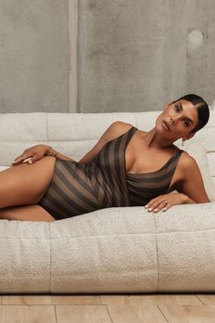 Espresso ventures into uncharted territory with neutrals. This captivating addition features strategically placed stripes that enhance every curve in this decadent, grounded style. With a deep chocolate brown on the reverse, it exudes an understated 'quiet luxury’ that’s both striking and down-to-earth. Comes with two waist ties. Complete the set with the Espresso Reversible Bikini Bottoms, or pair with the Espresso Dahlia Multiway Skirt, or Espresso Mesh Sarong for the complete look. Once Piece, Swim Wrap, Uncharted Territory, Brown One Piece, Australian Swimwear, Wrap Swimsuit, Long Sleeve Swim, Long Sleeve Wrap Top, Reversible Bikinis