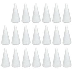 white plastic cones are lined up in rows on a white background, with the top cone slightly down