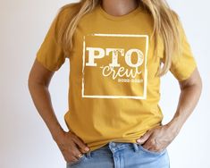 a woman wearing a yellow t - shirt with the words pto crew on it