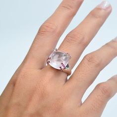 This stunning ring features a captivating cushion-cut Rose Quartz center stone, exuding a soft pink hue that symbolizes love and tranquility. The centerpiece is securely held by unique, stylish prongs adorned with vibrant Ruby gemstones, adding a touch of passionate red to the serene pink. The sleek, high-polished silver band enhances the overall elegance, making it a perfect statement piece for any occasion. This ring seamlessly blends modern design with classic charm, creating a timeless acces Polish Silver, Ruby Gemstone, Timeless Accessories, Quartz Rose, Natural Forms, Quartz Ring, Beautiful Rose, Jewelry Vintage, Contemporary Fashion