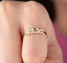 Our olive leaf ring is 14k solid gold. It is shaped like an ear of wheat or olive leaves. Some of the leaves of the wheat are decorated with zircon stones. It is a perfect ring for all-day-long use. When considered as a gift, it can be an excellent item for occasions like birthdays, anniversaries, graduations, valentine's days, or mother's days to make your loved ones happy. 🎁 If you want, you can add a gift note for your loved ones. It arrives in a special jewelry gift box. ✨ We respond to you Leaf Design Ring, Gold Rings Simple Unique Indian, Gold Finger Rings Unique, Gold Rings Simple Unique, Wheat Engagement Ring, Olive Ring, Gold Rings Women, Ring Leaf Design, Wheat Ring