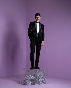 Ray Blaze Tuxedo Set - Contrast by Parth Bold, precise embroidery featuring intricate cutdana work in black and silver tones, elegantly complemented by a coordinating tux sash. Included in purchase: Tuxedo, Shirt, Pants, Bowtie and Sash Product Specification Color: Black (can be customized) Fabric: Italian Suiting Occasion: Formal Event, Wedding, Bridal, Reception Style: Tuxedo Designer: Contrast by Parth Care: Dry Clean Only Work: Hand Embroidered ( Variation in color, fabric & detail is possib Elegant Embellished Sets For Gala, Glamorous Formal Sets With Sequins, Glamorous Formal Sequined Sets, Glamorous Sequined Sets For Formal Occasions, Elegant Party Season Suits With Sequins, Elegant Sequined Suits For Party Season, Tailored Embellished Sets For Party, Luxury Embellished Formal Sets, Elegant Formal Sets With Sequins