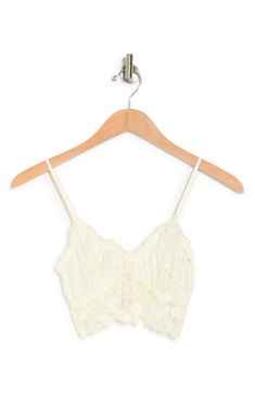 Delicate lace plays up the romantic charm on this soft cup bralette styled with dainty spaghetti straps. 90% nylon, 10% spandex
 Machine wash cold, lay flat to dry
 Imported Cream Lace Bra With Lace Trim, Beige Lace Bra With Lace Closure, Lace Camisole Bra With Lace Trim, Summer Bra With Lace Trim And Spaghetti Straps, White Camisole Bra With Lace Trim, Delicate Fitted Bra With Delicate Straps, White Lace Trim Camisole Bra, Beige Lace Camisole With Built-in Bra, Feminine Cream Lace Bra