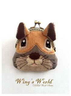 a small purse with a cat's face on it