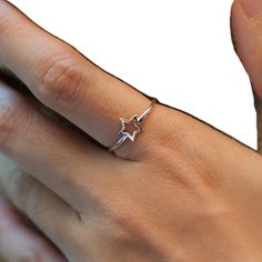 Nickel-free Star-shaped Promise Ring, Minimalist Star-shaped Midi Rings As Gift, Elegant Star-shaped Midi Rings As Gift, Minimalist Star-shaped Midi Rings For Gifts, Sterling Silver Stackable Star Rings, Silver Star-shaped Stackable Rings In Sterling Silver, Silver Star-shaped Stackable Promise Rings, Nickel-free Sterling Silver Star Ring, Adjustable Star Midi Rings For Promise