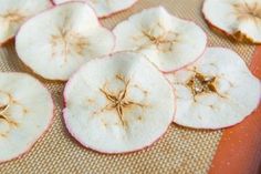 sliced apples sitting on top of a table