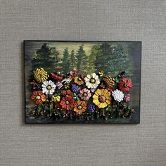 a painting on a wall with flowers in the foreground and trees in the background