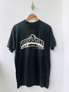 "Vintage" is a term that we don't take lightly. Our shops only feature tees that have been aged no less than 15 years.PLEASE ASK ANY QUESTION BEFORE BUYING!!! THIS IS USED CLOTHING!!! PLEASE DONT EXPECTED IT TO BE LIKE NEW OR IN PRISTINE CONDITION!!!PLEASE REFER TO THE ACTUAL/MANUAL SIZE TAKEN!!!Size  : LCondition : 8/10Made : Cropped TagColor :  Black /  Group LogoMeasurement :armpit to armpit= 21"inchesLenght from top of the shoulder to bottom= 29"InchesIn a good vintage condition Vintage but Retro Stonewashed Short Sleeve T-shirt, Stonewashed Band Merch T-shirt For Streetwear, Black Stonewashed Crew Neck T-shirt, Black Crew Neck Stonewashed T-shirt, Vintage Washed Black Stonewashed T-shirt, Vintage Stonewashed T-shirt In Washed Black, Stonewashed Band Merch T-shirt With Crew Neck, Band Merch Stonewashed Crew Neck T-shirt, Vintage Washed Black T-shirt With Letter Print