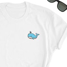 We have express delivery for our shirts! 📦⚡.  From cart to door in just 2-3 days, only for 3.5 USD extra.  You can find the express delivery option in the cart. Whale Shirt, Whale Ocean Tee Shirt, Whale Lover Tee Top, Whale Icon T-Shirt, Whale Gift Shirt, Ocean Lover Friend UNISEX Tee Shirt Gift Friends will love it! This t-shirt feels soft and lightweight, with the right amount of stretch. It's comfortable and flattering for both men and women.  * 100% cotton (heather colors contain polyester) * Fabric weight: 5 oz  * Shoulder-to-shoulder taping * Side-seamed Time for Delivery: * Processing & production time is 1-6 business days (usually 2-3 days). * U.S. Shipping time: 3-5 business days.  * International shipping time: 4-15 days. - Please note European customers: Some orders going to Eu Unisex White T-shirt With Funny Print, White T-shirt For Summer Gift, Unisex White Custom Print Shirt, Unisex White Shirt With Custom Print, White Letter Print T-shirt As Gift, White Custom Print Unisex Shirt, White Summer T-shirt For Gifts, White Summer T-shirt For Gift, White Summer T-shirt Gift