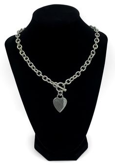 "Vintage Designer Style Heavy Sterling Silver Cable Chain Heart Charm Tag Necklace 17\" Up for offer is a beautiful designer style heavy solid sterling silver thick cable chain and heart charm tag pendant necklace.  This necklace features a toggle clasp.  Necklace is marked \"925 RW India\".   Note: Metal was tested using a rare earth magnet and jewelry acid.  The acid mark was then buffed out. Time Period: 1990s-2000s Measurements Necklace Length: 17\" Chain Width: 8.5mm Heart Charm Tag: L 1.10 Silver Heart Necklace With Chunky Chain, Silver Heart Pendant Charm Necklace On Cable Chain, Silver Charm Necklace With Heart Pendant And Cable Chain, Silver Toggle Necklace With Heart Charm, Silver Heart Pendant Charm Necklace With Cable Chain, Silver Heart Toggle Necklace With Charm, Silver Heart Toggle Necklace With Heart Charm, Silver Charm Necklace With Heart Pendant, Silver Cable Chain Necklace With Heart Pendant