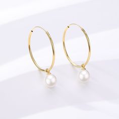 Unveil your elegance with our Freshwater Pearl Drop Large Hoop Earrings. Carefully constructed gold vermemil on Sterling Silver, these hoops offer a harmonious blend of contemporary grace and timeless appeal. The attached freshwater pearl renders a classic touch, creating a versatile piece that suits both everyday elegance and sophisticated soirées. Immerse yourself in the delicate charm and modern luxury of this exquisite pair. Pearls size: 8-9mm Gold Hoop Earrings With Pearl Charm In Sterling Silver, Classic Gold Pearl Huggie Earrings, Gold-plated Hoop Earrings With Pearl Drop For Anniversary, Gold Plated Hoop Earrings With Pearl Drop For Anniversary, Gold Pearl Hoop Earrings For Anniversary, White Gold Plated Hoop Pearl Earrings, Fine Jewelry Pearl Drop Hoop Earrings, Fine Jewelry Round Hoop Earrings With Pearl Drop, Gold Hoop Pearl Earrings With Ear Wire