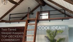 there is a ladder hanging from the ceiling in front of a sign that says cool idea