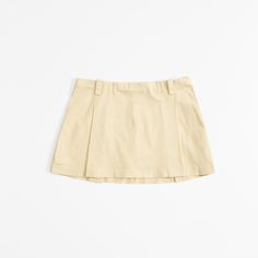 Mid rise mini skort in our crisp chino fabric, featuring belt loops, all-over pleating details, shorts lining for comfort and side zipper for a secure fit. Women's Bottoms, Sunny Yellow, Suits Coats, Athletic Fits, New Arrival Dress, Swimwear Accessories, American Apparel, Abercrombie Fitch, Side Zipper