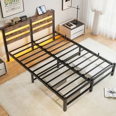 the bed frame is made from metal and has wooden slats on it, along with white rugs