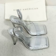 Good American Silver Snake Skin Lucite Slingback Heels Size 6 Brand New With Box And Dust Bag! Smoke Free Home. Heel Measures Approximately 4.25” Luxury Summer Slingback Pumps With Square Toe, Chic Square Toe Slingback Pumps For Party, Party Slingback Pumps With Wrapped Heel And Square Toe, Silver High Heel Slingback Sandals, Silver Slingback Sandals With Padded Heel For Party, Party Slingback Sandals With Reinforced Heel, Party Slingback Pumps With Sculpted Heel And Square Toe, Sculpted Heel Slingback Pumps With Square Toe For Party, Modern Slingback Sandals With Square Toe For Party