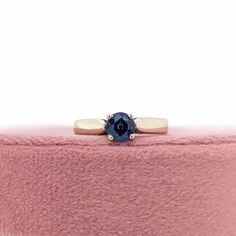 This beautiful ring features a 0.94 carat Blue Sapphire solitaire set in solid 14K gold. This Blue Sapphire ring makes a lovely September birthstone gift for your loved ones! This ring is made with solid 14K Gold. As listed, this ring is ready to ship. If you're interested in purchasing this setting with a different center stone please message us! Timeless Sapphire Solitaire Promise Ring, Blue Diamond Solitaire Birthstone Ring, Timeless Solitaire Sapphire Ring For Anniversary, Blue Solitaire Birthstone Ring In 14k Gold, 14k Gold Solitaire Sapphire Ring With Round Band, Classic Sapphire Birthstone Promise Ring, Timeless 14k Gold Solitaire Sapphire Ring, Timeless 14k Gold Sapphire Ring With Tension Setting, Sapphire Round Cut Birthstone Ring For Promise