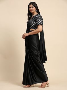 This stunning ensemble features a black color satin pre-stitched saree that is ready-to-wear and comes with a fully stitched blouse in sizes S to L. The saree is beautifully complemented by a similar colored satin blouse with intricate zari work, adding a touch of elegance and sophistication to your look.
This designer saree include a designer belt for added flair and convenience, measuring 5.50 meters in length. The pre-stitched design allows you to effortlessly drape the saree and be party-rea Engagement Gown, Lehenga Crop Top, Stitched Saree, Lehenga Choli Wedding, Floral Lehenga, Party Wear Lehenga Choli, Reception Gown, Bollywood Lehenga, Cocktail Wear