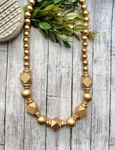 Excited to share this item from my #etsy shop: Gold wood bead statement necklace. Lightweight Gold Beaded Necklace. Chunky Bead Necklace. Gold. Handmade beaded necklace. Easy Necklace, Chunky Bead Necklace, Black Opal Pendant, Gold Beaded Necklace, Handmade Beaded Necklace, West Lafayette, Crystal Point Necklace, Chunky Bead Necklaces, Wood Bead Necklace