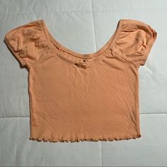 Pacsun Short Sleeve Top Brand New!!! Never Been Worn Color: Orange/Peach Size: Small Stretch Short Sleeve Crop Top For Beach Season, Summer Crop Top With Short Sleeves For Day Out, Trendy Solid Color Tops For Beach Season, Trendy Solid Tops For Beach Season, Orange Stretch Summer Tops, Pink Short Sleeve Crop Top For Beach, Orange Cropped Top For Beach, Summer Beach Crop Top With Scoop Neck, Casual Solid Color Crop Top For Summer