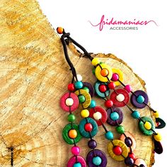 This colorful necklace is inspired by Frida Kahlo and features hand-painted coconut shells and cotton ropes. It will add a dramatic and bohemian touch to your outfit, making a confident and stylish statement. Elevate your look with just one bold piece of jewelry that will surely steal the show! DETAILS: Color: Multi-color Material: Coconut Shell, Wood, Cotton Rope Style: Statement Bohemian/Ethnic Necklace Technique: Handmade - Hand-Painted - Handcrafted • Full package tracking. Your order’s ship Frida Kahlo Earrings, Shells Necklace, Coconut Shells, Colorful Necklace, Classic Outfit, Mexican Jewelry, Ethnic Necklaces, Bold Jewelry, Inspired Necklace