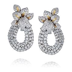 Transform your style into a blooming masterpiece with our exquisite 18K Two Tone 13 carat Diamond Statement Flower Earrings! Brace yourself for the spotlight as these captivating earrings take center stage. Crafted with meticulous attention to detail, these earrings feature a stunning array of round diamonds set in lustrous 18K gold. Their impressive size and brilliant sparkle are bound to make heads turn and hearts skip a beat.With a centerpiece of 13 carats, these flower earrings embody sheer Luxury Flower Shaped Diamond Earrings With Accents, Luxury Flower-shaped Diamond Earrings With Accents, Luxury Flower Shaped Diamond Earrings, Luxury Diamond White Flower Earrings, Luxury Flower Shaped Cluster Earrings For Formal Occasions, Luxury Flower Shaped Cluster Earrings For Formal Events, Luxury Flower-shaped Cluster Earrings For Formal Occasions, Luxury Diamond Cluster Earrings In Flower Shape, Luxury White Flower Diamond Earrings