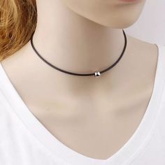 Classic black choker silver or gold ball charm simple chic everyday wear matches any outfit This product description features a classic black choker with a silver or gold ball charm, perfect for simple and chic everyday wear that effortlessly complements any outfit. Adjustable Clavicle Chain Choker, Everyday Clavicle Chain Choker, Simple Adjustable Choker Jewelry, Adjustable Dainty Black Choker, Simple Choker As Gift, Casual Everyday Jewelry Choker, Casual Everyday Choker Jewelry, Black Choker With Clavicle Chain, Silver Round Pendant Choker