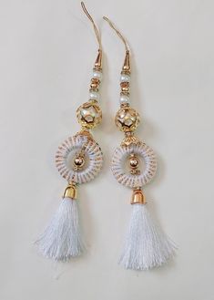 Hand made Women Hand Made Tassels Lehanga Latkan Hand  Work New Fancy Designer Tassel Fabric Silk   2 PC   Libas Fashion latkan  Beautiful Pair of Latkans & Brooch Accessory For You Decorative Products. In Indian These Latkans Are Normally Used as The Accessory For Lengha & Sari Blouse On The Back, But These Can Be Used in Many Other Ways to Metal & Pearl scan be used at an door. Rajasthan is a State in India for these kind of Art works Ethnic, Casual and Party Wear Designs Lahenga party latkan Luxury Latkans Earrings For Festivals, Cheap Bohemian Latkans Earrings, Luxury Traditional Wear With Latkans, Cheap Latkans Drop Earrings, Luxury Jewelry With Latkans For Rituals, Latkan Tassels Blouses Big And Heavy Accessories, Cheap Party Chandelier Earrings With Latkans, Luxury Chandbalis With Latkans For Wedding, Cheap Gold Necklace With Latkans