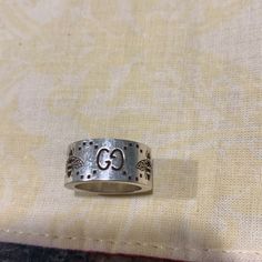 This Ring Is Sterling Silver And A Size 4. It Is Hallmarked With The 925 And The Gucci Name. The Outside Of The Band Sports The Interlocking Gg Logo Along With The Bee (Three Of Each). If You Have A Small Ring Size This Is For You. Gucci Ring, Gucci Rings, Small Ring, Gucci Jewelry, Gg Logo, The Bee, Small Rings, Womens Jewelry Rings, Hallmark