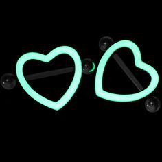 two neon green heart shaped earrings with black studs on the back and one has a glow in the dark earring