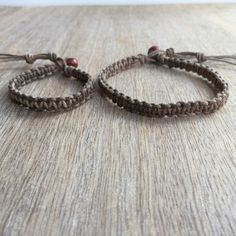 "These lovely bracelets were made using hemp cord. Designed for everyday wear. Both bracelets are adjustable. The big bracelet closes to around 7\"-8\" and the small one closes to around 5\"-6\". Please feel free to contact me if you have any questions For more Daddy and me/ Mom and Son Bracelets: https://www.etsy.com/shop/Fanfarria?section_id=17007792&ref=shopsection_leftnav_4 Check all Fanfarria's products: https://www.etsy.com/shop/fanfarria?section_id=16963242&ref=shopsection_leftnav Braided Natural Jewelry As Gift, Natural Braided Jewelry Gift, Natural Braided Jewelry As Gift, Natural Color Braided Jewelry Gift, Friendship Brown Beaded Bracelets With Sliding Knot, Earthy Adjustable Friendship Bracelets With Sliding Knot, Adjustable Earthy Friendship Bracelets, Earthy Adjustable Bracelet With Sliding Knot, Adjustable Brown Jewelry For Friendship