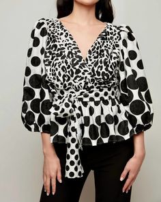 Pair this with your favorite jeans and slides for your next girls night out. Off-the-shoulder and on-trend. Chic mix print blouse. True to size. Machine washable. ALBERTO MAKALI Puff-Sleeve Blouse in Black/White | Black/White | Materials & Care Instructions: ['100% Polyester', 'Imported'] Chic V-neck Blouse With Graphic Print, Trendy Blouse With Blouson Sleeves For Night Out, Chic Graphic Print Blouse For Fall, Chic Graphic Print Tops, Chic Blouse With Bold Print, Casual Party Top With Blouson Sleeves, Fall Graphic Print Blouse For Day Out, Trendy Bold Print Blouse For Fall, Trendy Printed Puff Sleeve Tops