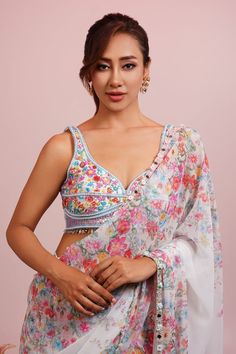 White pre-draped saree featuring floral print with mirror embellished hem. Paired with a padded hand embroidered blouse. - Aza Fashions Floral Print Pre-draped Saree For Navratri Party, Party Blouse With Floral Print And Traditional Drape, Party Blouse Piece For Diwali With Floral Print, Bollywood Style Floral Print Blouse With Traditional Drape, Summer Traditional Pre-draped Saree With Printed Motifs, Summer Designer Wear Floral Pre-draped Saree, Reception Floral Print Georgette Blouse Piece, Bollywood Style Designer Blouse With Floral Print, Bollywood Style Party Blouse With Printed Motifs