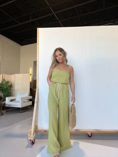 Details Strapless Tube Top Gauze Jumpsuit with Waist Tie Drawstring and Pockets Color: Dusty Lime Material: 100% Cotton Size Runs True to Size Model Is Wearing a Size Small Model Measurements Size: 4 Height: 5'2" Weight: 135lbs Bust: 35" Waist: 28" Hips: 37" Bra Size: 34D Green Strapless Jumpsuits And Rompers For Beach, Green Strapless Jumpsuit For Beach, Green Strapless Jumpsuits For The Beach, Strapless Green Jumpsuit For The Beach, Strapless Beach Sets For Summer, Strapless Summer Beach Sets, Strapless Jumpsuits And Rompers For Summer Loungewear, Spring Strapless Jumpsuit For Loungewear, Gauze Jumpsuit