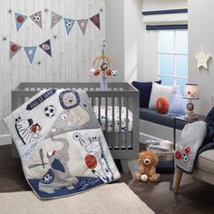 a baby's room is decorated in blue and white