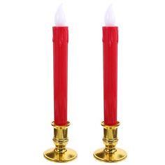 two red candles sitting on top of each other