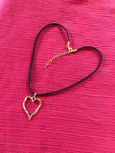 "Gold plated Heart pendant on a 18\" black cord which is adjustable by the gold plated extender. The enamel Heart pendant is 30mm x 38mm  Each Necklace will come in a gift box. FREE POSTAGE (Second Class) within the UK. Upgrade to First class post for an additional cost and International postage and packaging £4.50. This item would be the ideal gift to show someone you love them, perfect for a valentine gift or as a birthday/Mother's Day gift or Christmas." Enamel Necklaces, Necklace Heart, Valentine Gift, Gold Heart, Heart Of Gold, First Class, Heart Necklace, Heart Pendant, Valentine Gifts