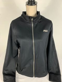 Fila Sport Jacket Size XL Color: black Material: polyester and cotton bag 18LJN Black Functional Cotton Track Jacket, Black Cotton Track Jacket For Outdoor, Black Cotton Windbreaker For Sports, Black Cotton Outdoor Track Jacket, Black Cotton Track Jacket With Pockets, Black Fleece Jacket With Zipper Closure, Black Long Sleeve Cotton Track Jacket, Black Long Sleeve Fleece Jacket With Zipper, Black Cotton Functional Outerwear