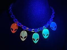 This Rainbow Alien Choker is made with a thick chain that will last!Wear this to your next festival!This glows AMAZING in Blacklight!Choker is 8" round.Matching Alien Earrings Also Available! Rave Jewelry For Halloween Party, Rave Multicolor Choker For Festivals, Trendy Halloween Festival Choker, Alien Earrings, Edc Outfits, Festival Accessories, Black Light, Choker, Choker Necklace