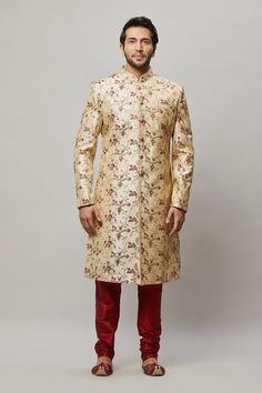 Men's floral embroidered sherwani with shades of Red, Blush & Sage in the flowers and petal Comes with a Red churidar Crafted with a collar neckline, full sleeves, and front button closure. Occasion: Can be worn to events like Sangeet, & Wedding WASH CARE INSTRUCTIONS - Please Dry clean only when it is applicable. Slight color variation is possible due to digital photography. Necklace not included Formal Nehru Jacket With Floral Embroidery And Straight Cut, Formal Nehru Jacket With Floral Embroidery And Straight Fit, Formal Straight Nehru Jacket With Floral Embroidery, Bollywood Style Floral Embroidered Sherwani For Eid, Eid Bollywood Sherwani With Floral Embroidery, Festive Sherwani With Floral Embroidery For Festivals, Designer Floral Embroidered Traditional Sherwani, Elegant Sherwani With Floral Embroidery, Formal Sherwani With Floral Embroidery For Diwali